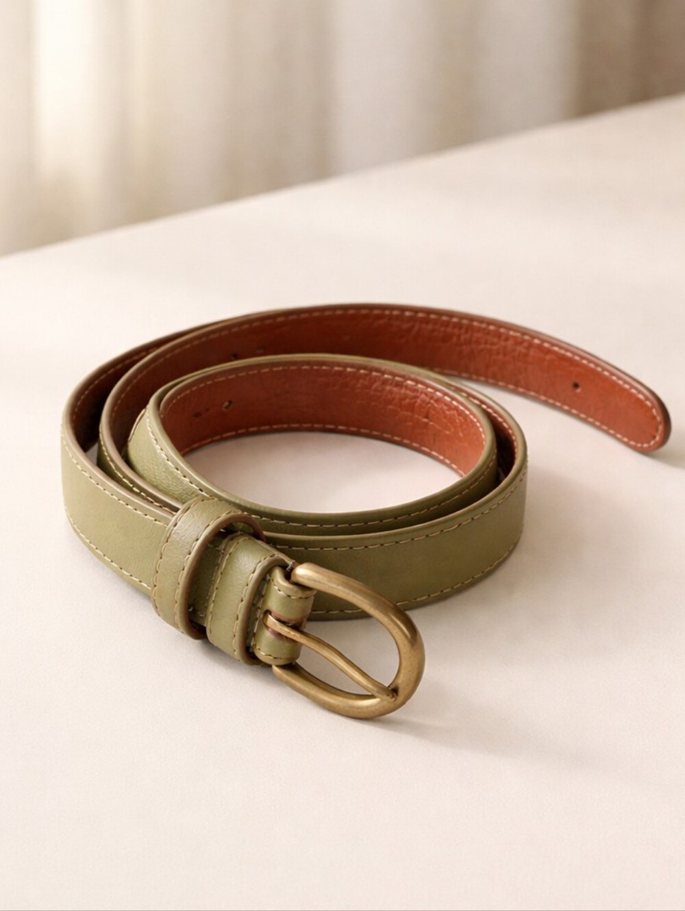 American Apparel small belt. 1st hole at 25". Last hole at 28"